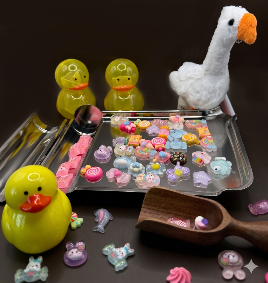 Duck Duck Goose prize box with charms on counting tray
